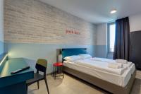 A bed or beds in a room at MEININGER Milano Lambrate