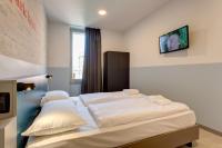 A bed or beds in a room at MEININGER Milano Lambrate