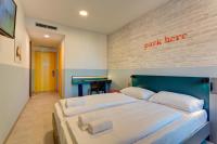 A bed or beds in a room at MEININGER Milano Lambrate