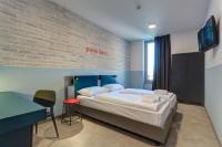 A bed or beds in a room at MEININGER Milano Lambrate