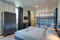 A bed or beds in a room at MEININGER Milano Lambrate