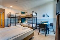 A bed or beds in a room at MEININGER Milano Lambrate