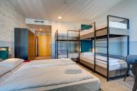 A bed or beds in a room at MEININGER Milano Lambrate