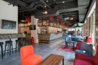 A seating area at MEININGER Milano Lambrate