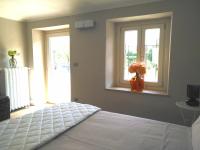 Postel nebo postele na pokoji v ubytování B&B "Madama Granèt"