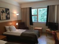 Postel nebo postele na pokoji v ubytování Finlandia Hotel Fooninki