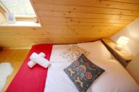 Posteľ alebo postele v izbe v ubytovaní Apartament Olczanka Zakopane