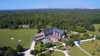 an aerial view of a large house in a field at Domaine de la Forêt d&#39;Orient, Logis Hôtel, Restaurant, Spa et Golf in Rouilly-Sacey