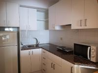 A kitchen or kitchenette at URH Ciutat de Mataró