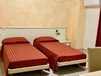 A bed or beds in a room at B&B Il Girasole
