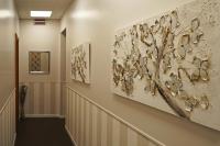 a hallway with two paintings on the wall at Hotel Genova Liberty in Genoa