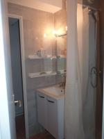 a bathroom with a sink and a shower at Appartement T2 RDC, Front de Mer, 4 couchages, Les Balcons de la Méditerranée Narbonne Plage in Narbonne-Plage