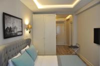 TV a/nebo společenská místnost v ubytování Centrum Suites İstanbul