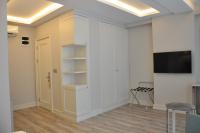 TV a/nebo společenská místnost v ubytování Centrum Suites İstanbul