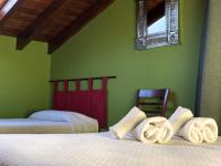 Postel nebo postele na pokoji v ubytování Hotel San Francisco Rural