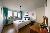 Posteľ alebo postele v izbe v ubytovaní WSTApartments Salezego 6 Apartament z widokiem na Stadion Narodowy