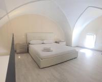 A bed or beds in a room at B&B MARIO PAGANO