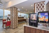 A kitchen or kitchenette at Marcello Hotel