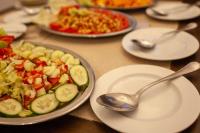 a table topped with plates of food and spoons at Daniela Diving Resort Dahab in Dahab
