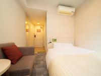 Natural Hot Spring SUPER HOTEL Kumamoto Chamber of Commerceにあるベッド