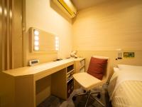 Natural Hot Spring SUPER HOTEL Kumamoto Chamber of Commerceにあるベッド