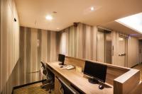 an office with a desk with two monitors on it at Green World Sansui in Taipei
