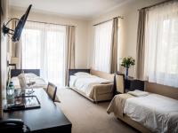 Łóżko lub łóżka w pokoju w obiekcie Hotel Vitalia