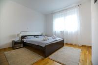 Posteľ alebo postele v izbe v ubytovaní Apartman Reno