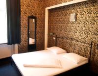 Posteľ alebo postele v izbe v ubytovaní Hotel Goldene Spinne