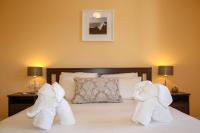A bed or beds in a room at VILLA OLIVEIRA by Buenavilla