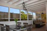 A seating area at VILLA OLIVEIRA by Buenavilla