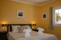A bed or beds in a room at VILLA OLIVEIRA by Buenavilla