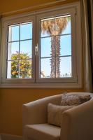 A seating area at VILLA OLIVEIRA by Buenavilla