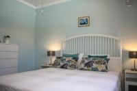 A bed or beds in a room at VILLA OLIVEIRA by Buenavilla