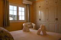 A bed or beds in a room at VILLA OLIVEIRA by Buenavilla