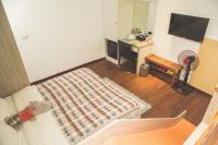 an aerial view of a living room with a rug at Happy Castle Cottage in Hualien City