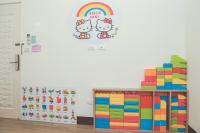 a rainbow and hello kitty decal on a wall at Nan Jing 222 Homestay in Hualien City