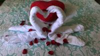 a group of stuffed animals on a bed with hearts at Maison Lolly corse wifii free in Borgo