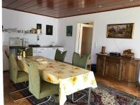 a dining room with a table and chairs at Ferienhaus Annerose in Wendisch Rietz