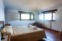 Postel nebo postele na pokoji v ubytování Azienda Agrituristica Le Terre Di San Leonardo