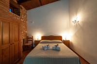 Postel nebo postele na pokoji v ubytování Azienda Agrituristica Le Terre Di San Leonardo