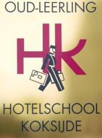 a sign with a man with a suitcase on it at Hotel du Bassin in Ostend