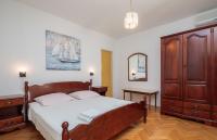 Postel nebo postele na pokoji v ubytování Apartments and Rooms Denis