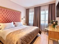 Postel nebo postele na pokoji v ubytování Hotel Boutique ADOLFO