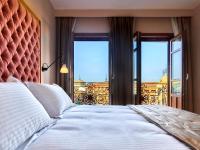 Postel nebo postele na pokoji v ubytování Hotel Boutique ADOLFO