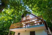 a house with a balcony on top of it at Holiday Home Vanda in Bakar