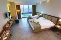A bed or beds in a room at Yildiz Life Hotel