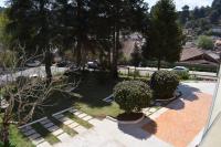 an aerial view of a garden with bushes and trees at Pousada Sino dos Ventos in Campos do Jordão