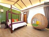 a bedroom with a bed and a large swing at Follow Me designed B&amp;B in Dongshan