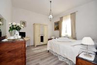A bed or beds in a room at Shabby House Nonna Peppa